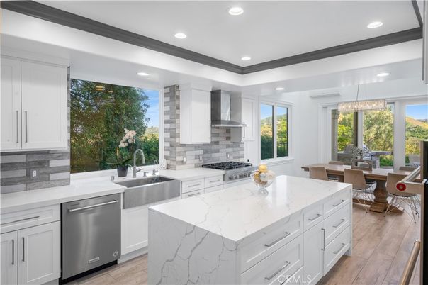 Dining room, Interior, Kitchen, Pendant Lights, Recessed Lighting, Stainless Steel Appliances, Wood Texture Flooring