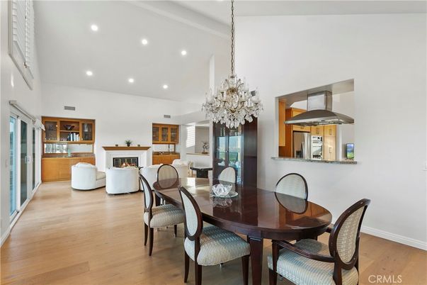 Chandelier, Dining room, Fireplace, Interior, Kitchen, Living room, Pendant Lights, Recessed Lighting, Wood Texture Flooring