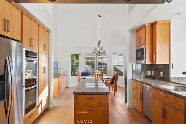 Chandelier, Dining room, Interior, Kitchen, Stainless Steel Appliances, Wood Texture Flooring