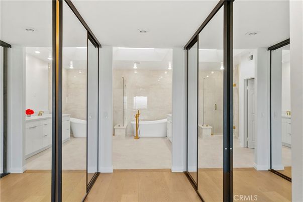 Bathroom, Free Standing Baths, Glass Shower, Interior, Marble Walls, Recessed Lighting, Wood Texture Flooring