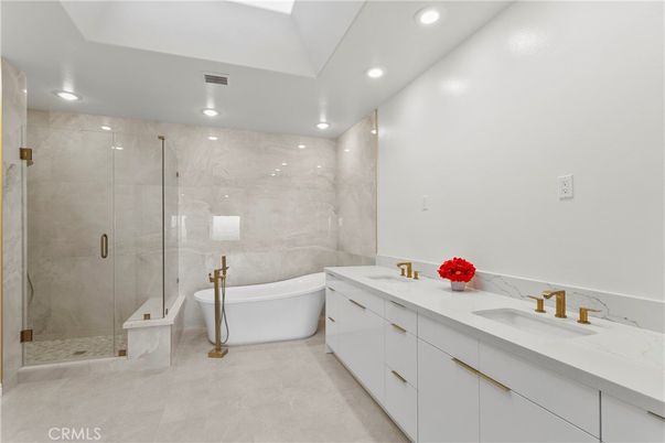 Bathroom, Dual Sink Vanities, Free Standing Baths, Glass Shower, Interior, Marble Walls, Recessed Lighting