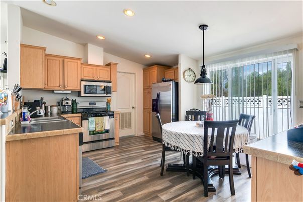 Dining room, Interior, Kitchen, Pendant Lights, Recessed Lighting, Stainless Steel Appliances, Wood Texture Flooring