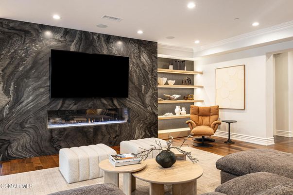 Fireplace, Interior, Living room, Marble Walls, Recessed Lighting, Wood Texture Flooring