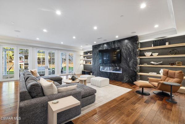 Fireplace, Interior, Living room, Marble Walls, Recessed Lighting, Wood Texture Flooring