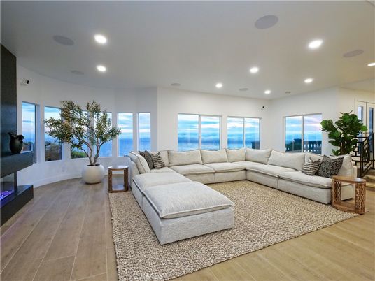 Fireplace, Interior, Living room, Recessed Lighting, Water, Wood Texture Flooring