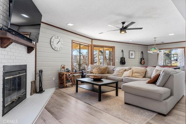 Fireplace, Interior, Living room, Pendant Lights, Recessed Lighting, Stone Walls, Wood Texture Flooring