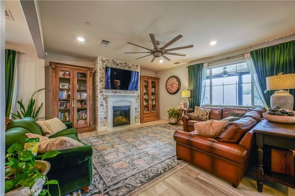 Fireplace, Interior, Living room, Recessed Lighting, Stone Walls, Wood Texture Flooring