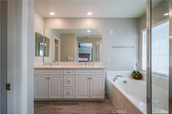 Bathroom, Dual Sink Vanities, Interior, Recessed Lighting, Wood Texture Flooring