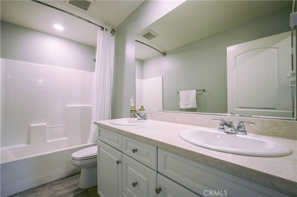 Bathroom, Dual Sink Vanities, Interior, Recessed Lighting, Wood Texture Flooring