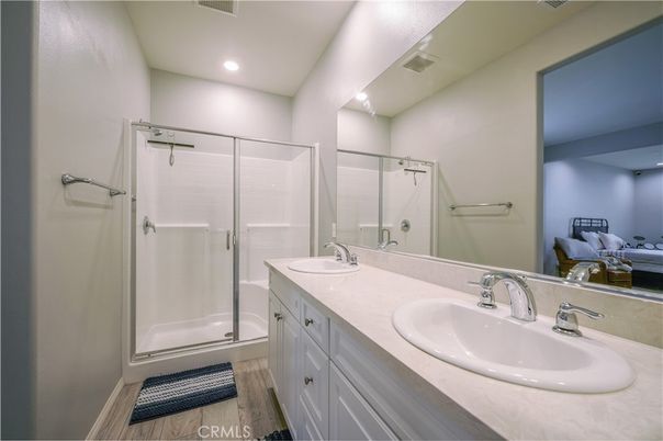Bathroom, Dual Sink Vanities, Glass Shower, Interior, Recessed Lighting, Wood Texture Flooring