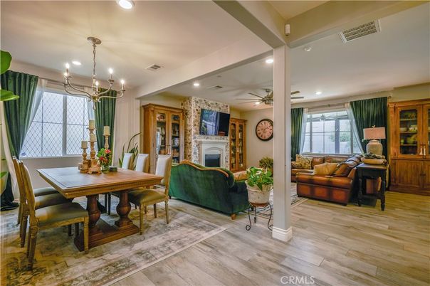 Chandelier, Dining room, Fireplace, Interior, Living room, Recessed Lighting, Wood Texture Flooring