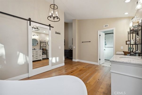 Bathroom, Free Standing Baths, Interior, Pendant Lights, Recessed Lighting, Wood Texture Flooring