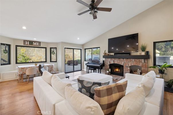 Dining room, Fireplace, Interior, Living room, Piano, Recessed Lighting, Wood Texture Flooring