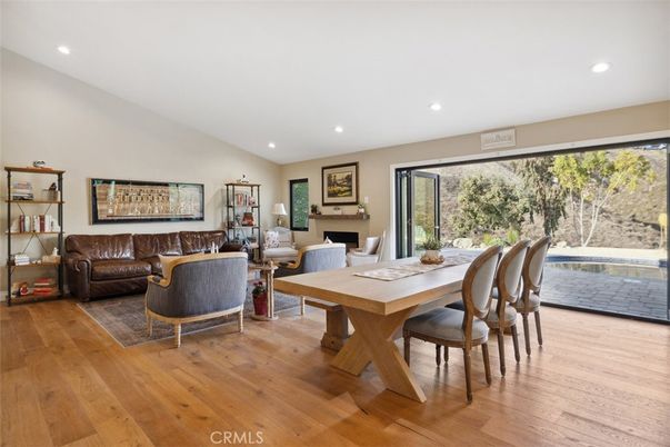 Dining room, Fireplace, Interior, Living room, Recessed Lighting, Wood Texture Flooring