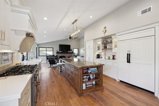 Chandelier, Dining room, Fireplace, Interior, Kitchen, Living room, Pendant Lights, Recessed Lighting, Wood Texture Flooring