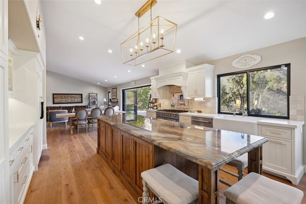 Chandelier, Dining room, Interior, Kitchen, Pendant Lights, Recessed Lighting, Stainless Steel Appliances, Wood Texture Flooring