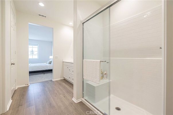 Bathroom, Bedroom, Glass Shower, Interior, Recessed Lighting, Wood Texture Flooring