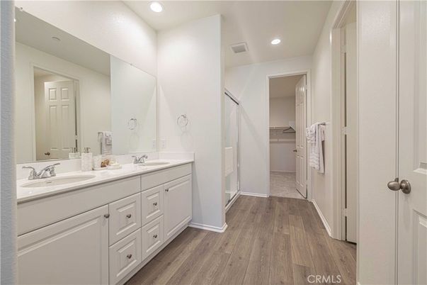 Bathroom, Dual Sink Vanities, Interior, Recessed Lighting, Walk-in Closets, Wood Texture Flooring