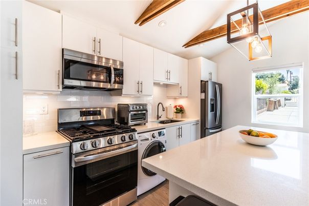 Interior, Kitchen, Recessed Lighting, Stainless Steel Appliances, Washer, Wooden Beams, Wood Texture Flooring
