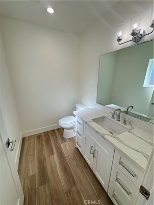 Bathroom, Dual Sink Vanities, Interior, Recessed Lighting, Wood Texture Flooring