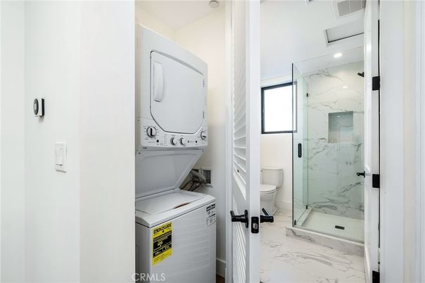 Bathroom, Glass Shower, Interior, Marble, Marble Walls, Recessed Lighting, Utility Closets, Washer