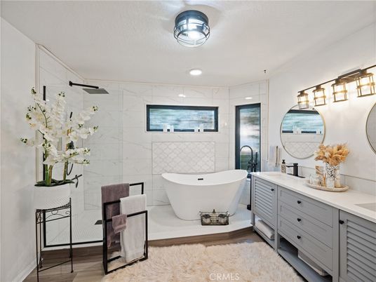 Bathroom, Dual Sink Vanities, Free Standing Baths, Interior, Marble Walls, Recessed Lighting, Wood Texture Flooring