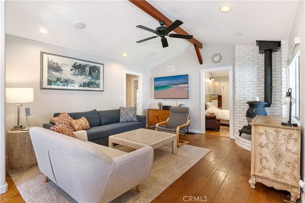 Fireplace, Interior, Living room, Recessed Lighting, Stone Walls, Wood Texture Flooring
