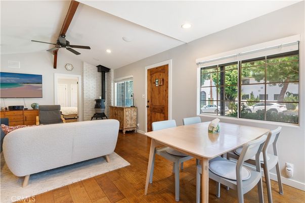 Dining room, Fireplace, Interior, Living room, Recessed Lighting, Stone Walls, Wood Texture Flooring