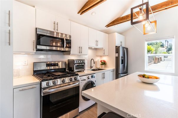 Interior, Kitchen, Recessed Lighting, Stainless Steel Appliances, Washer, Wooden Beams, Wood Texture Flooring