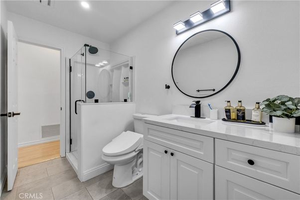 Bathroom, Dual Sink Vanities, Glass Shower, Interior, Recessed Lighting, Wood Texture Flooring