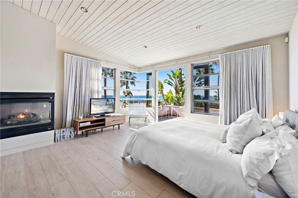 Bedroom, Fireplace, Interior, Recessed Lighting, Water, Wood Texture Flooring