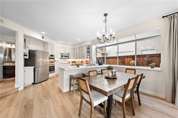 Chandelier, Dining room, Interior, Kitchen, Recessed Lighting, Stainless Steel Appliances, Wood Texture Flooring