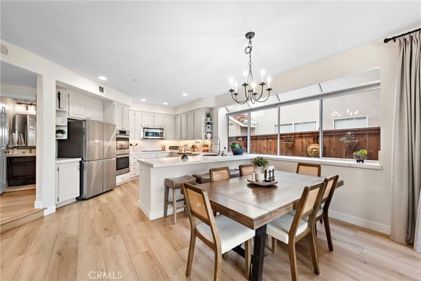 Chandelier, Dining room, Interior, Kitchen, Recessed Lighting, Stainless Steel Appliances, Wood Texture Flooring