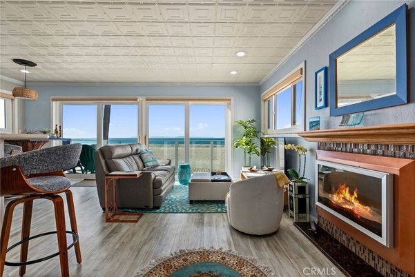 Fireplace, Interior, Living room, Pendant Lights, Recessed Lighting, Water, Wood Texture Flooring
