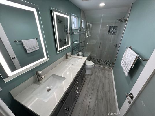 Bathroom, Dual Sink Vanities, Glass Shower, Interior, Recessed Lighting, Wood Texture Flooring