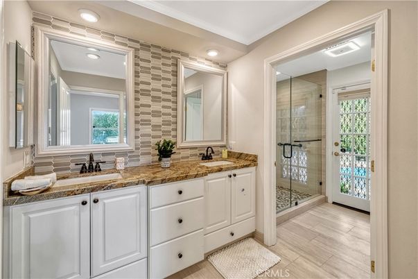 Bathroom, Dual Sink Vanities, Glass Shower, Interior, Recessed Lighting, Wood Texture Flooring