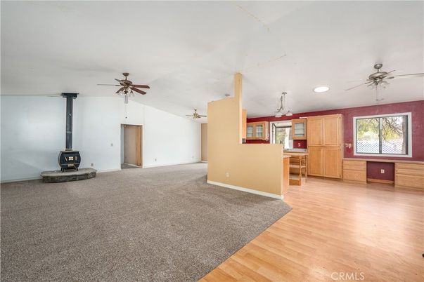 Empty room, Fireplace, Interior, Recessed Lighting, Stone Walls, Wood Texture Flooring