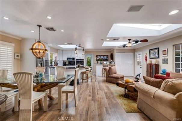 Chandelier, Dining room, Interior, Kitchen, Living room, Pendant Lights, Recessed Lighting, Stainless Steel Appliances, Wood Texture Flooring