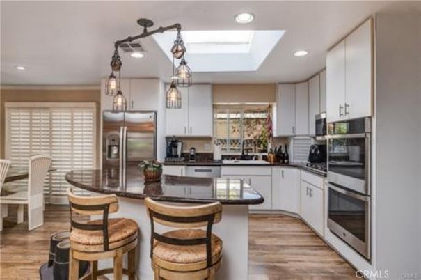 Chandelier, Dining room, Interior, Kitchen, Pendant Lights, Recessed Lighting, Stainless Steel Appliances, Wood Texture Flooring