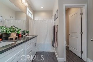 Bathroom, Dual Sink Vanities, Interior, Recessed Lighting, Wood Texture Flooring
