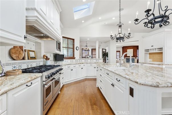 Chandelier, Interior, Kitchen, Pendant Lights, Recessed Lighting, Stainless Steel Appliances, Wood Texture Flooring