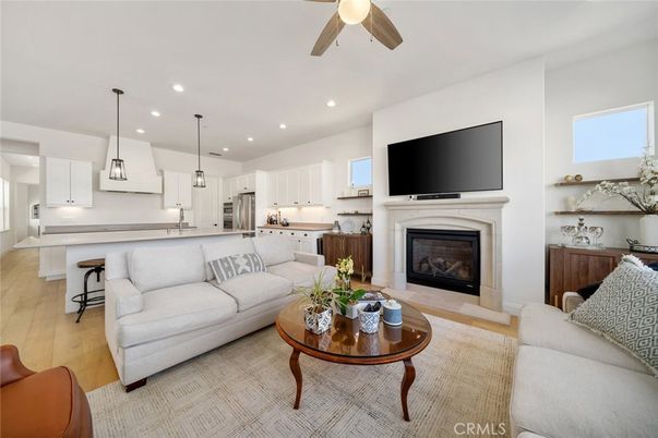 Fireplace, Interior, Kitchen, Living room, Pendant Lights, Recessed Lighting, Stainless Steel Appliances, Wood Texture Flooring