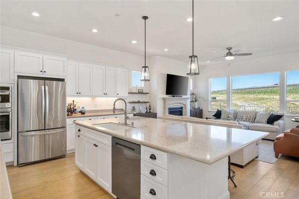 Fireplace, Interior, Kitchen, Living room, Pendant Lights, Recessed Lighting, Stainless Steel Appliances, Wood Texture Flooring