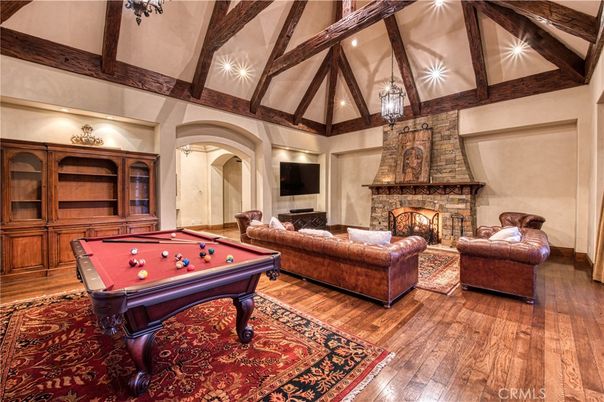 Billiard Table, Fireplace, Game Room, Interior, Living room, Pendant Lights, Wooden Beams, Wood Texture Flooring