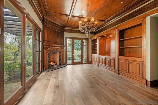 Chandelier, Empty room, Fireplace, Interior, Recessed Lighting, Wooden Ceilings, Wood Texture Flooring, Wooden Walls