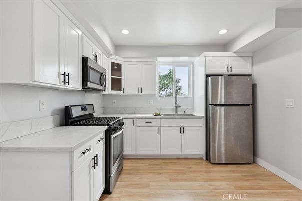 Interior, Kitchen, Recessed Lighting, Stainless Steel Appliances, Wood Texture Flooring