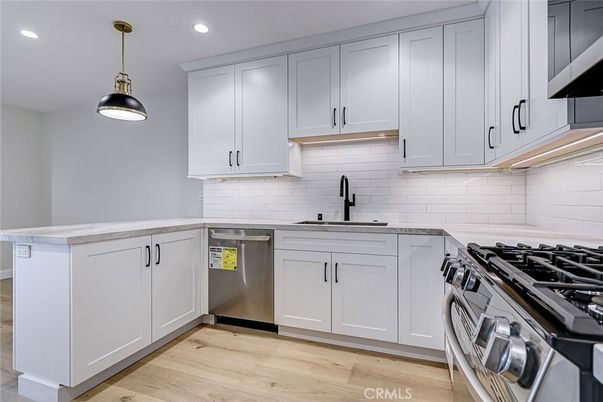 Interior, Kitchen, Pendant Lights, Recessed Lighting, Stainless Steel Appliances, Wood Texture Flooring