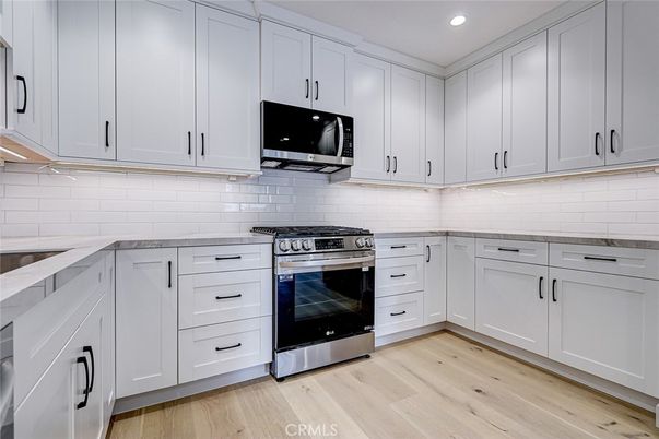 Interior, Kitchen, Recessed Lighting, Stainless Steel Appliances, Wood Texture Flooring