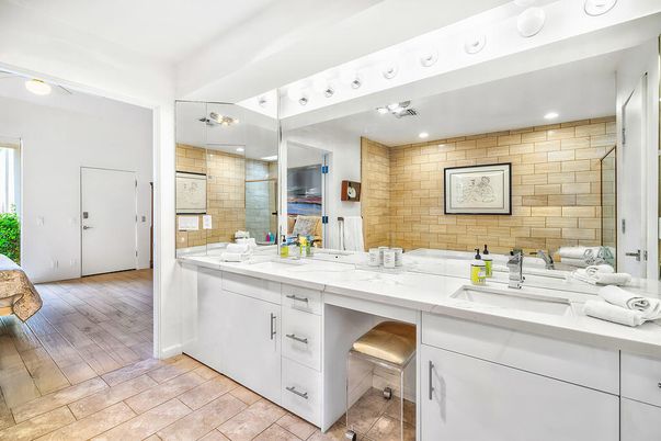 Bathroom, Dual Sink Vanities, Interior, Recessed Lighting, Stone Walls, Wood Texture Flooring