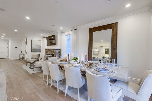 Dining room, Fireplace, Interior, Living room, Recessed Lighting, Wood Texture Flooring